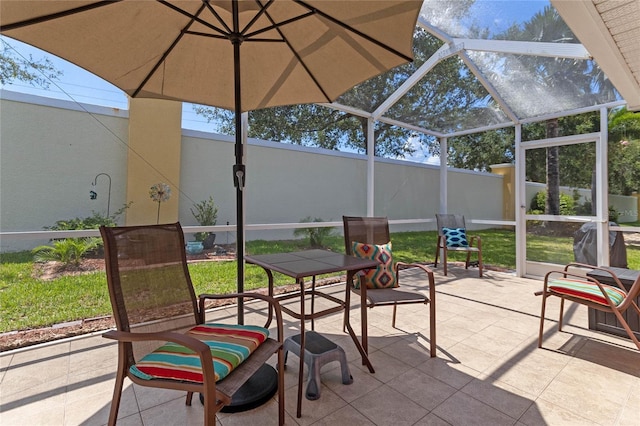 view of patio featuring a lanai