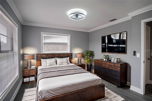 bedroom featuring dark hardwood / wood-style floors and ornamental molding