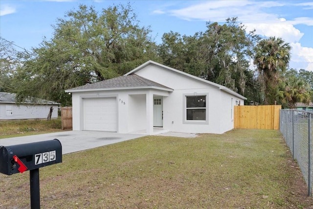 view of front of home with a garage and a front yard