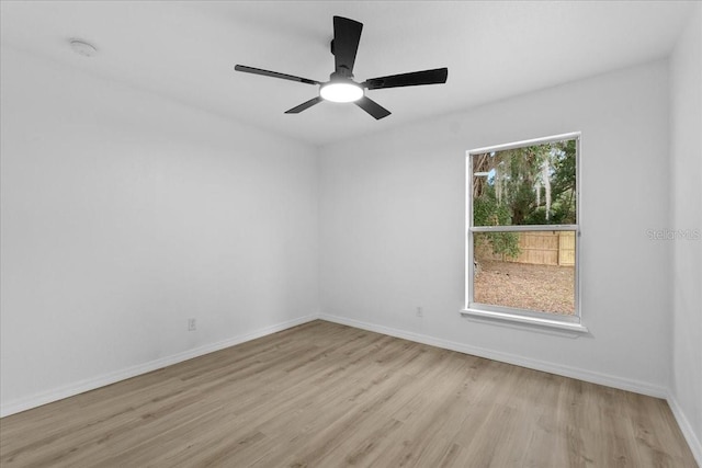 spare room featuring ceiling fan and light hardwood / wood-style floors