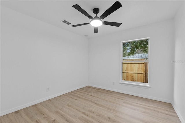 spare room featuring ceiling fan and light hardwood / wood-style flooring