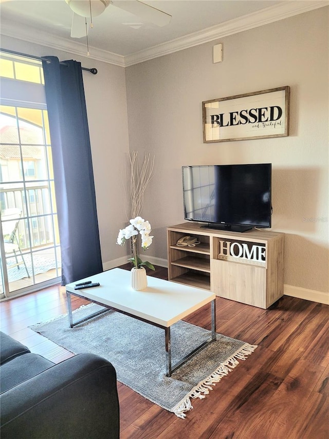 living room with a wealth of natural light, crown molding, and dark wood-type flooring