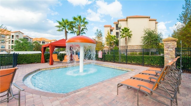 view of pool featuring a gazebo and pool water feature