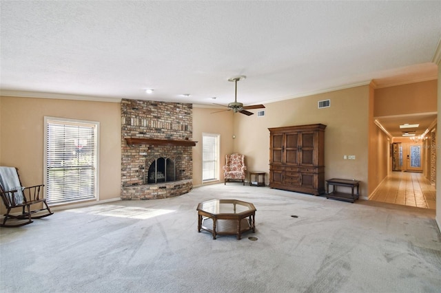 unfurnished living room with light colored carpet, ornamental molding, and a fireplace