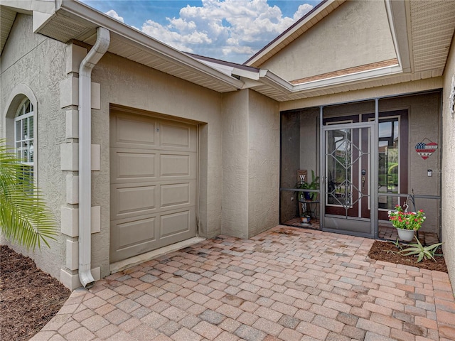 entrance to property featuring a garage