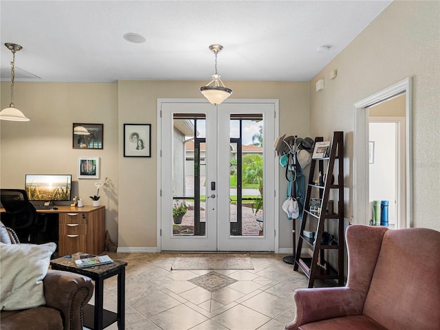 entryway featuring light tile patterned floors and french doors