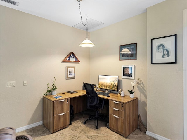 office space with light tile patterned floors