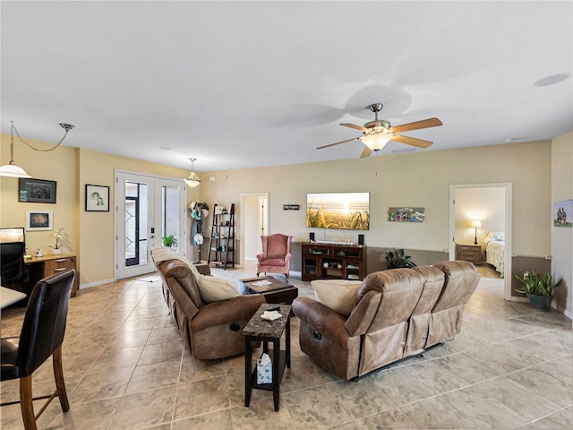 living room with ceiling fan, french doors, and light tile patterned flooring