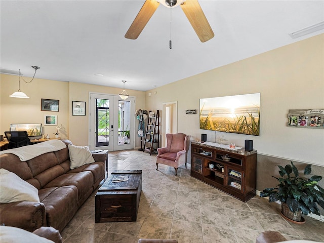 living room with ceiling fan and french doors