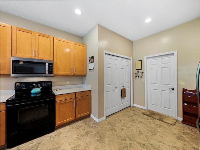 kitchen featuring black range with electric cooktop