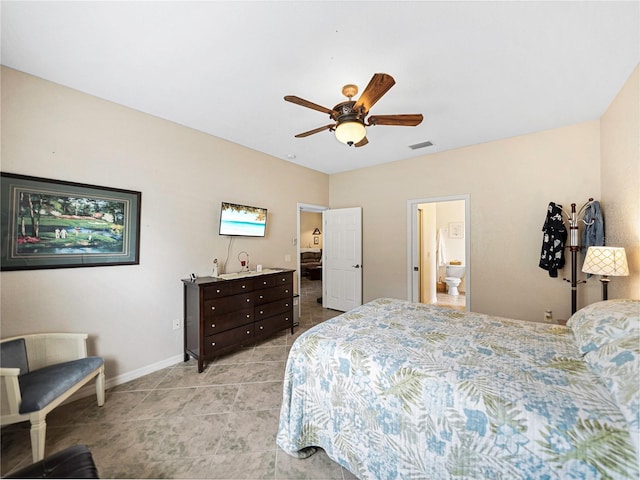 bedroom featuring ceiling fan and ensuite bath