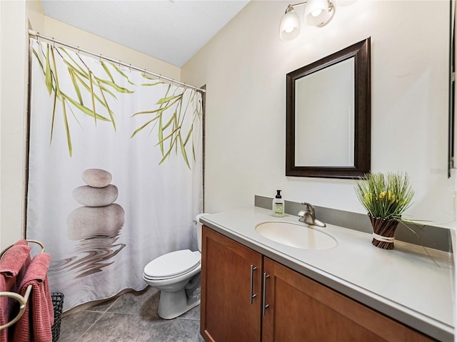 bathroom with toilet, vanity, and curtained shower