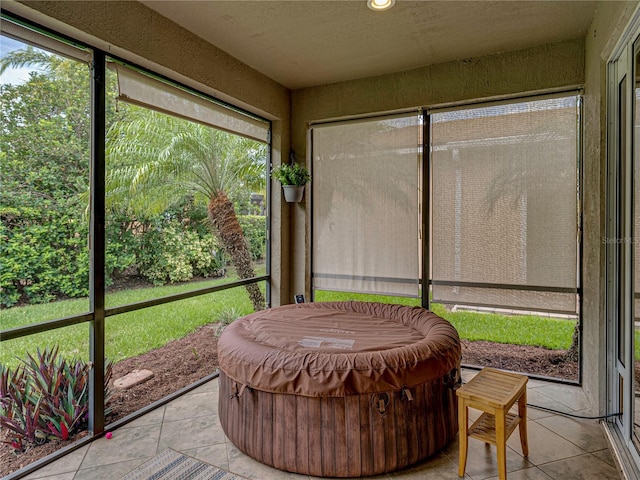 sunroom / solarium with a hot tub