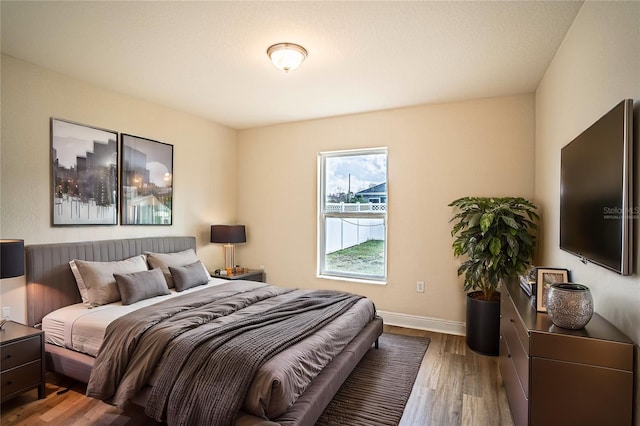 bedroom with hardwood / wood-style flooring