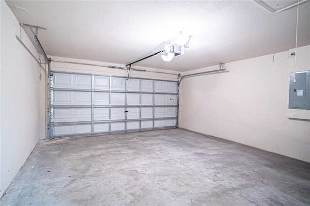 garage with a garage door opener and electric panel