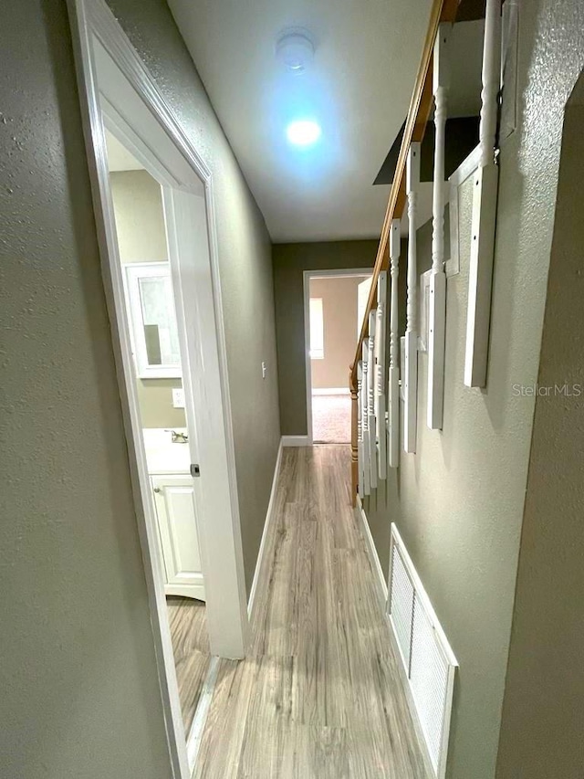 hallway featuring light hardwood / wood-style flooring