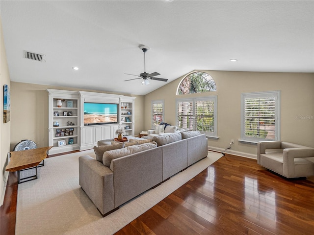 living room with lofted ceiling, dark wood-type flooring, and ceiling fan