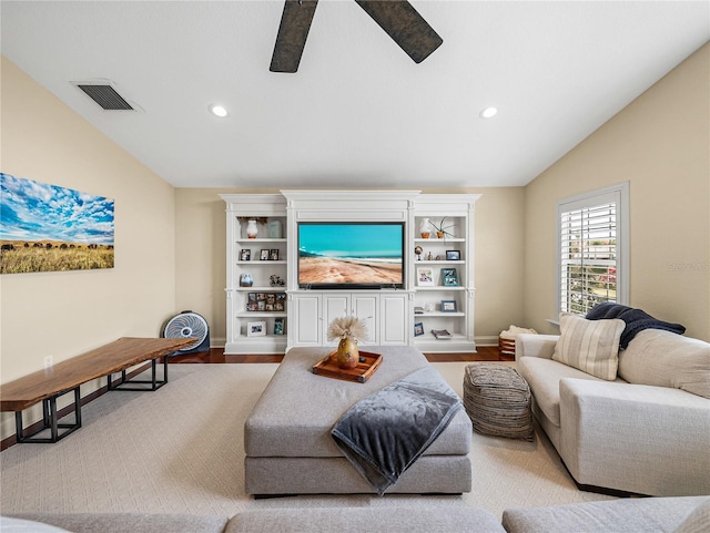 living room featuring vaulted ceiling, ceiling fan, and light wood-type flooring