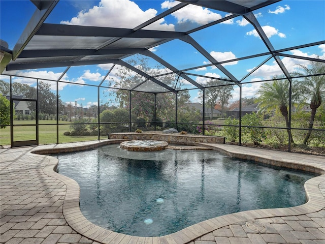 view of pool with a lanai and a patio