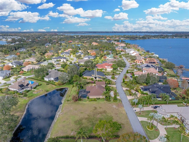 aerial view with a water view and a residential view