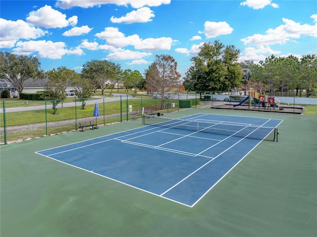 view of sport court with a playground