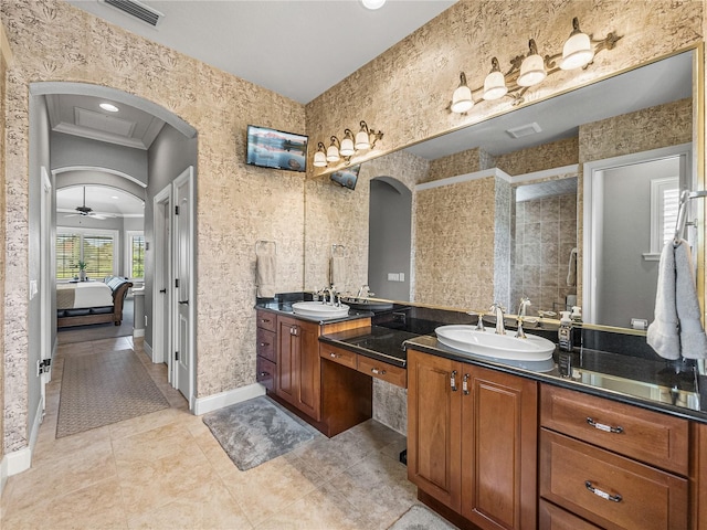 bathroom with crown molding, vanity, and tile patterned flooring