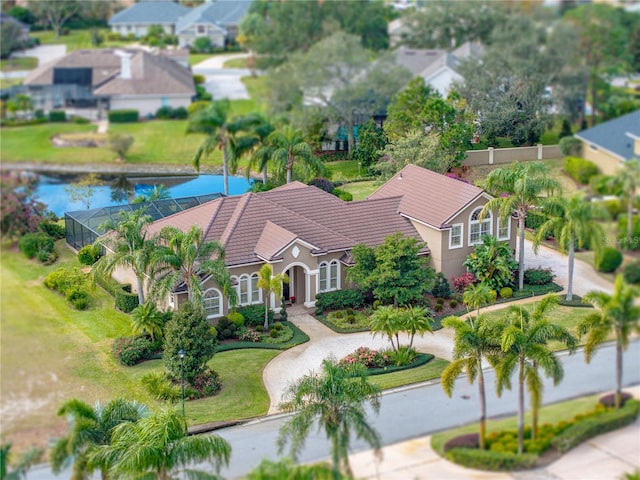 drone / aerial view featuring a residential view and a water view