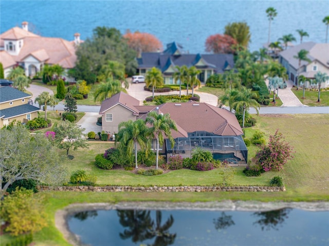 aerial view with a water view and a residential view