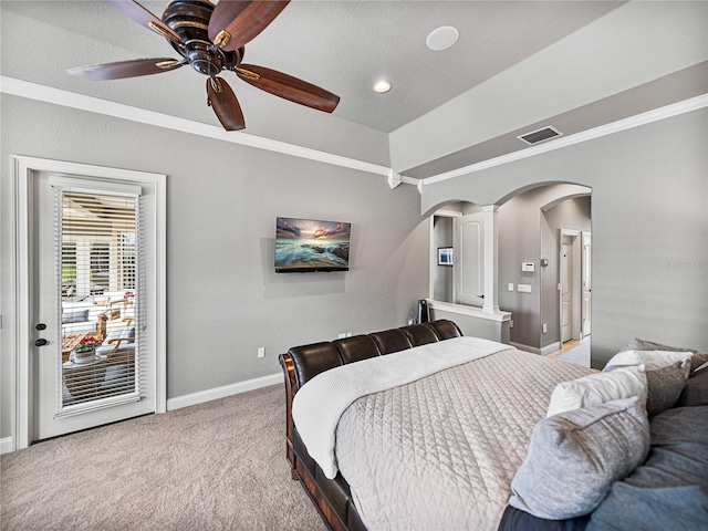 bedroom with arched walkways, carpet flooring, visible vents, baseboards, and crown molding