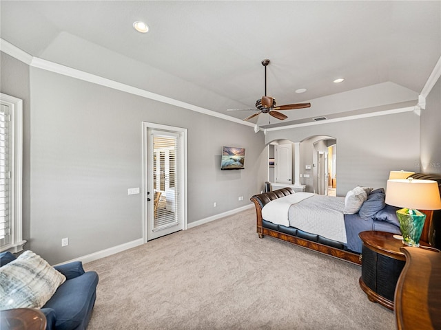 carpeted bedroom with baseboards, multiple windows, arched walkways, and ornamental molding