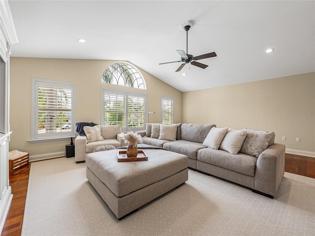 living area featuring ceiling fan, recessed lighting, wood finished floors, baseboards, and vaulted ceiling