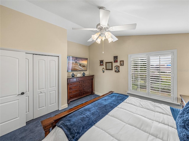 bedroom with baseboards, lofted ceiling, ceiling fan, carpet, and a closet