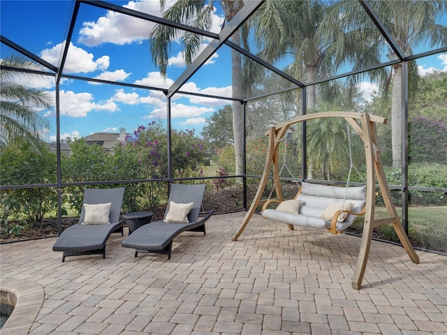 view of patio / terrace featuring a lanai