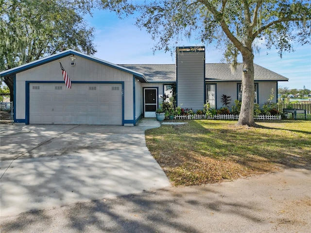 single story home featuring a front yard and a garage