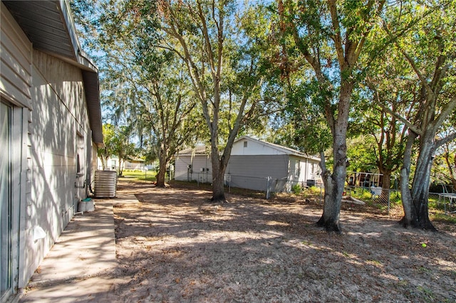 view of yard featuring central AC unit