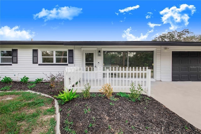 ranch-style house featuring a garage