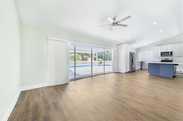 unfurnished living room with hardwood / wood-style floors, ceiling fan, and lofted ceiling