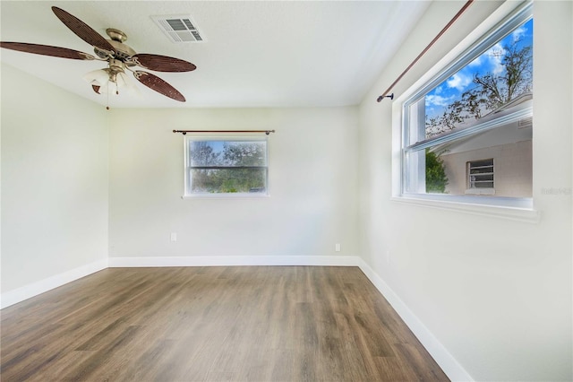 spare room with ceiling fan and wood-type flooring