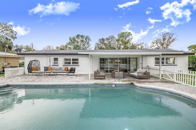 rear view of house featuring a patio area and an outdoor hangout area