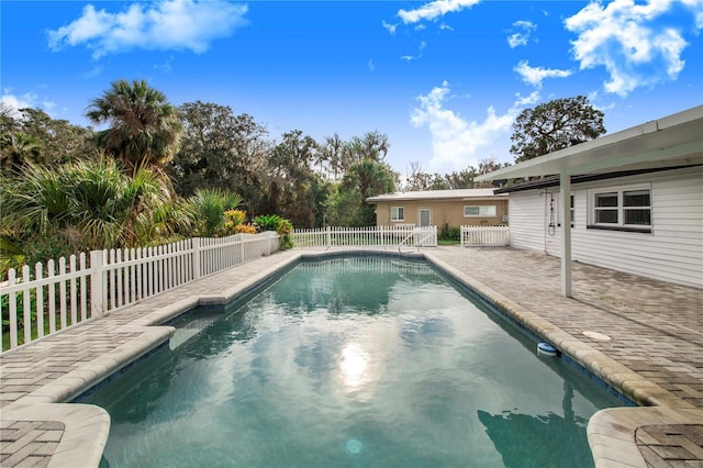 view of pool featuring a patio area