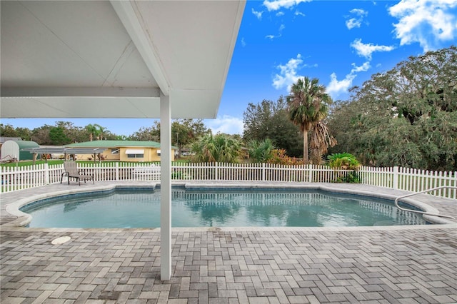 view of swimming pool with a patio