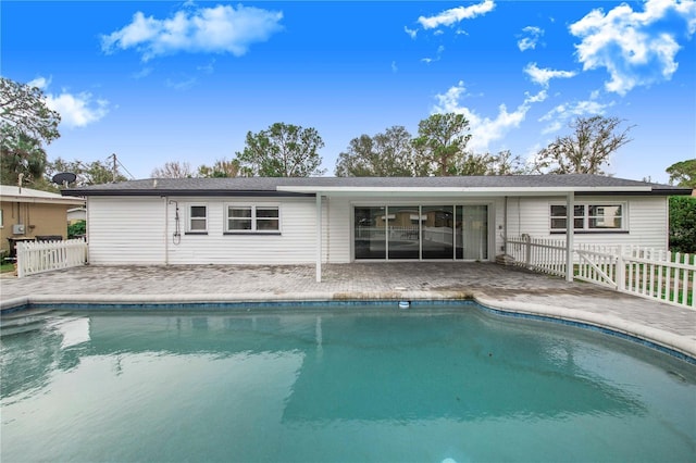 back of property featuring a patio area