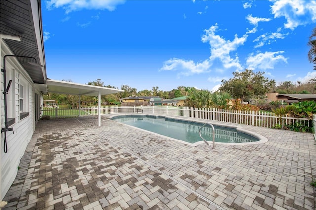 view of swimming pool with a patio area