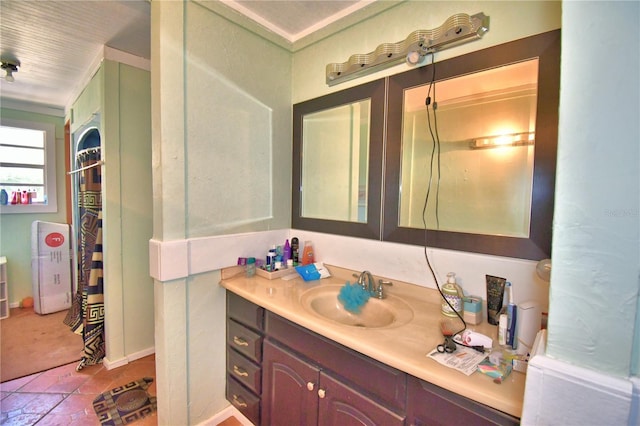 bathroom with vanity, tile patterned floors, and ornamental molding