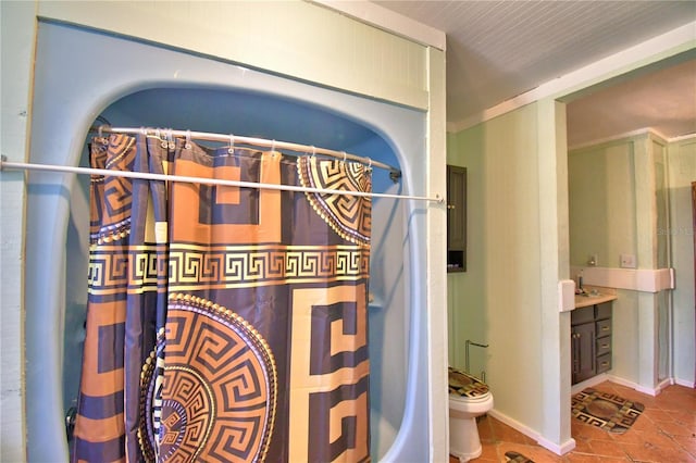 bathroom featuring tile patterned flooring, vanity, and toilet