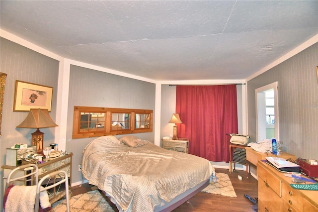 bedroom with hardwood / wood-style floors