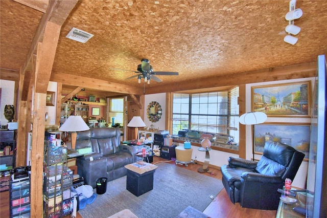 living room featuring ceiling fan and wood-type flooring