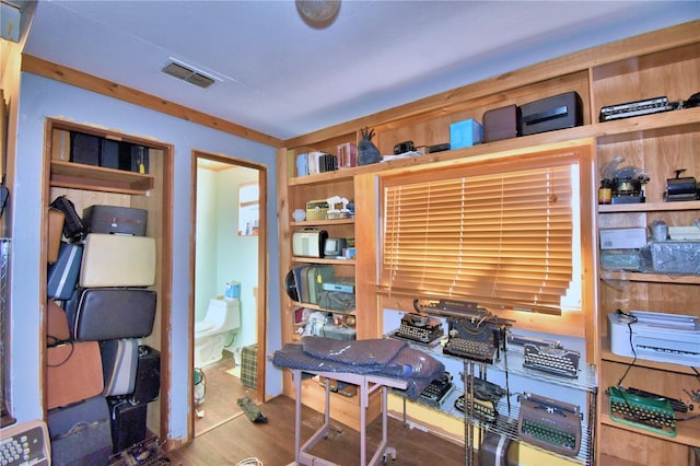 home office with hardwood / wood-style floors