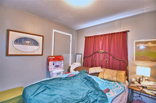 bedroom featuring a textured ceiling