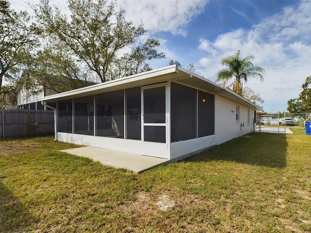 rear view of property with a yard